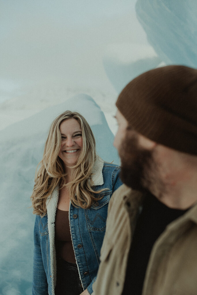 couple smiling during their engagement photoshoot 