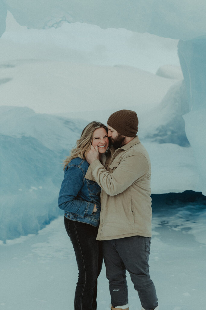 fiance kissing his fiance on the forehead