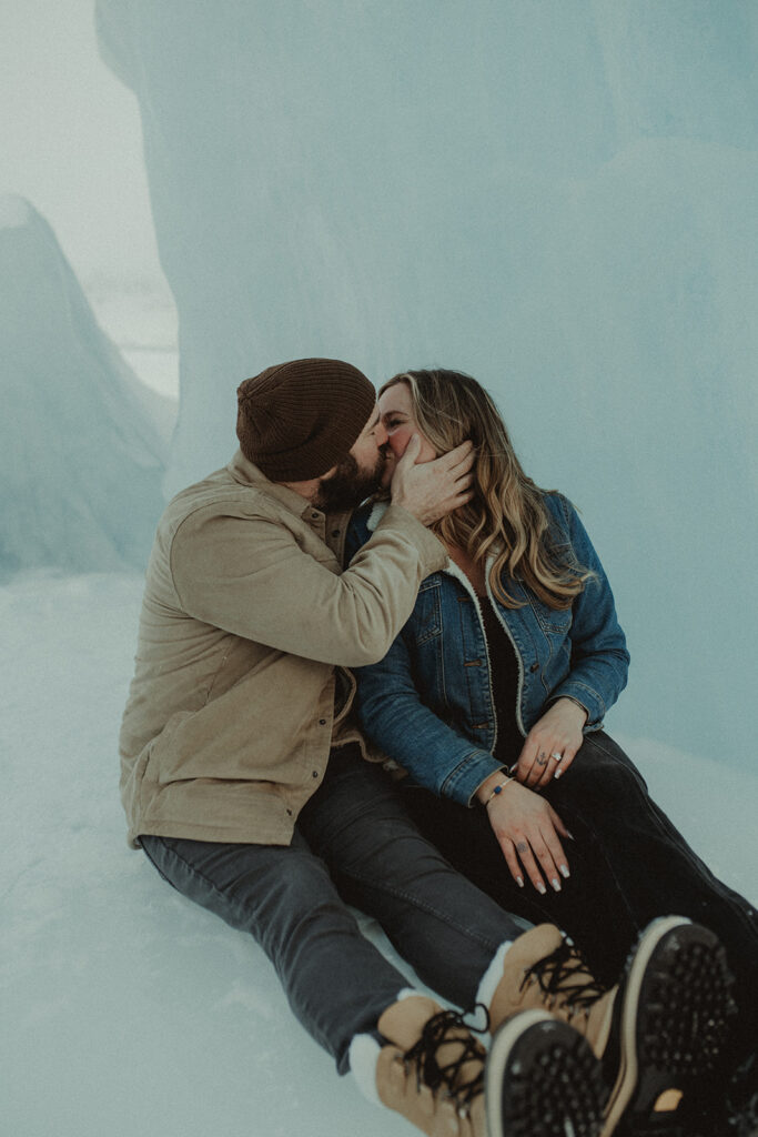 couple kissing during their adventurous engagement