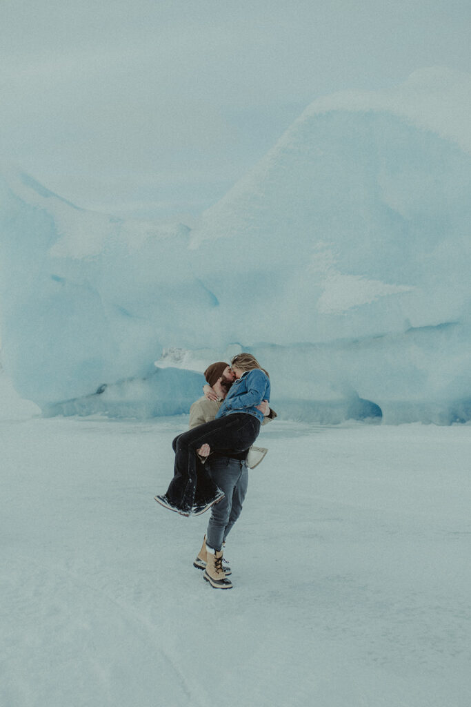 fiance holding his fiance during their photoshoot