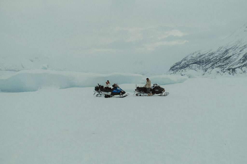 couple at their winter engagement in ski motorcycle