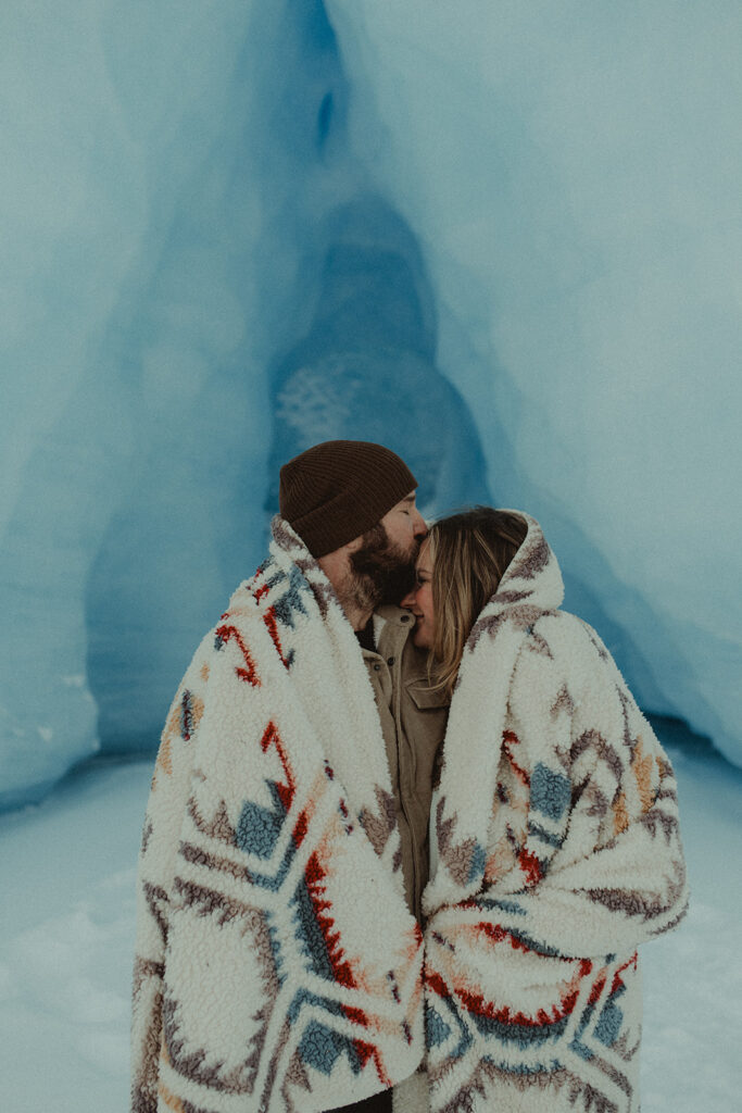 fiance kissing his fiance on the forehead 