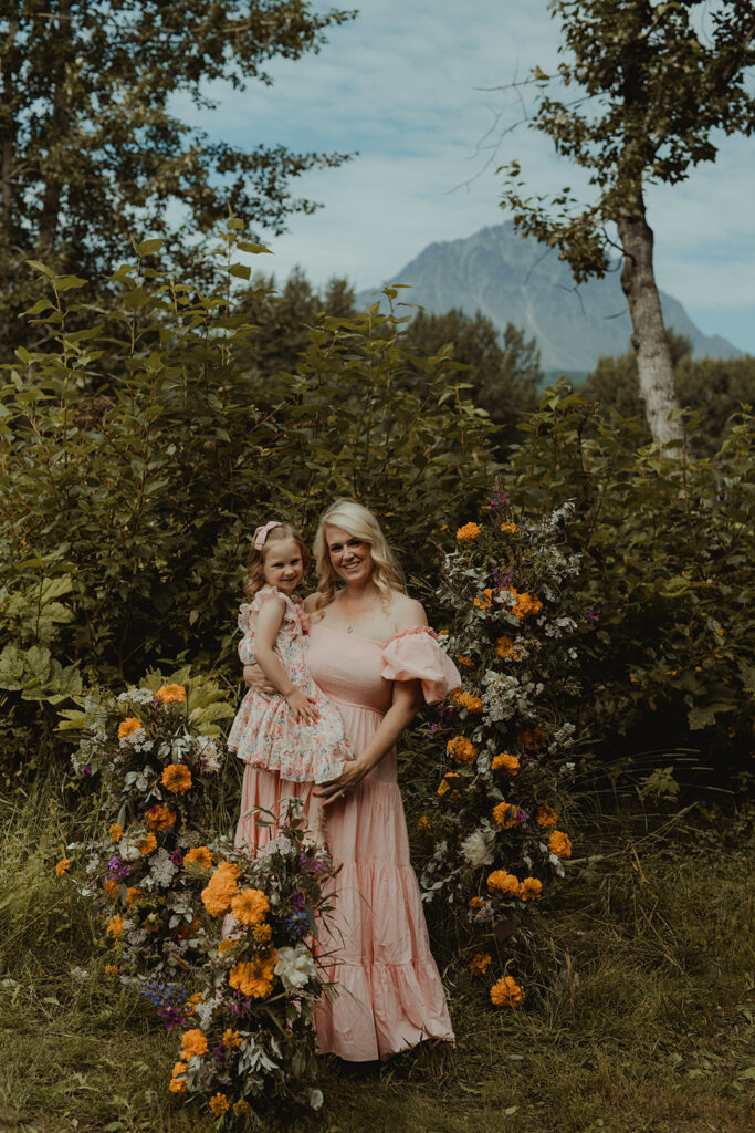 mom holding her daughter during their photoshoot