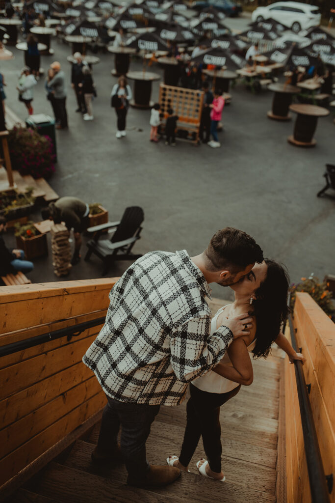 couple kissing during their playful engagement session