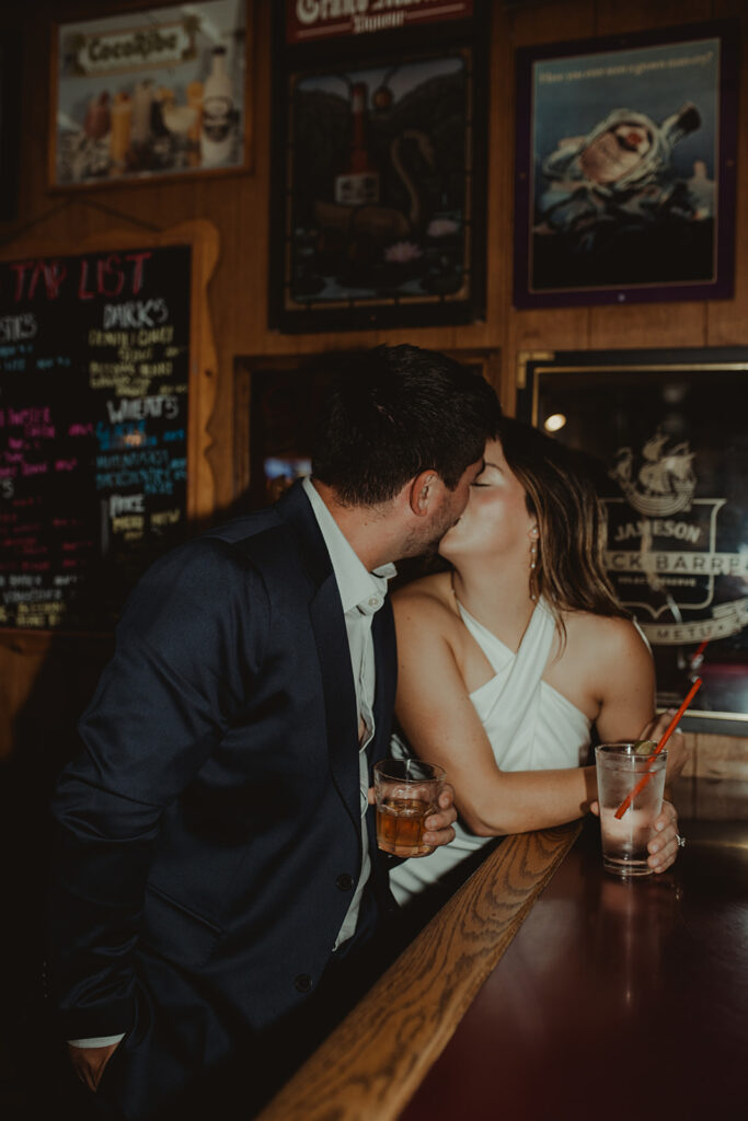 newly engaged couple kissing