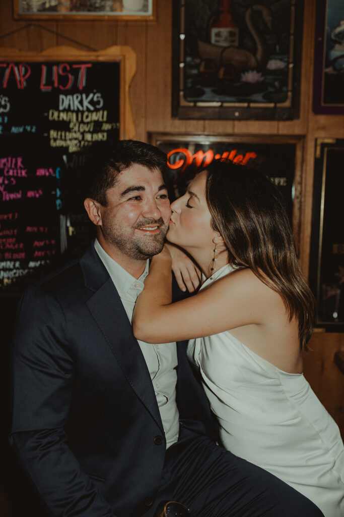 fiance kissing her fiance on the cheek