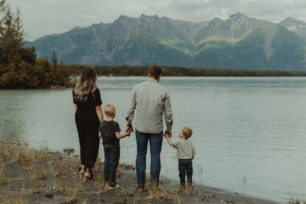 family at their photoshoot at the lake in alaska