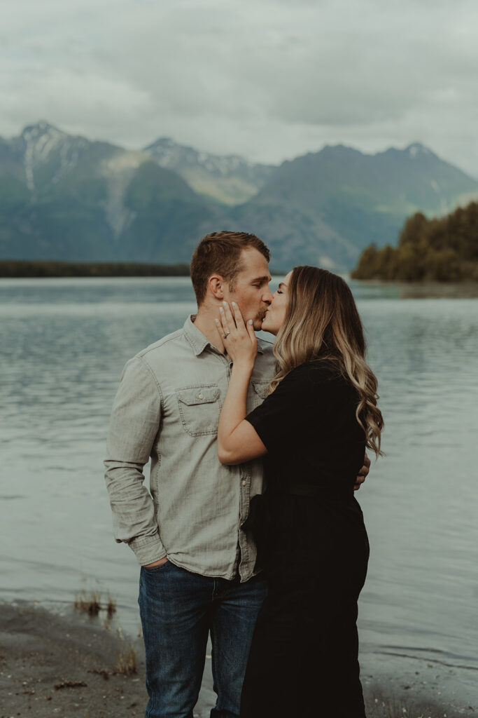 couple kissing during their family photoshoot