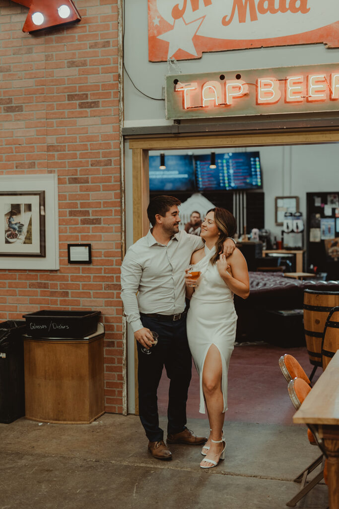 couple walking around their favorite brewery