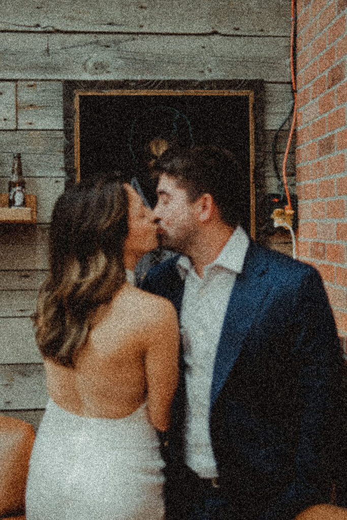 cute couple kissing during their engagement photoshoot