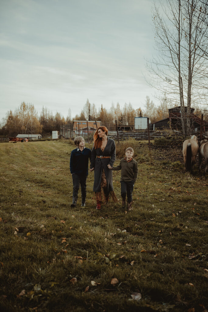 family walking around the ranch during their session