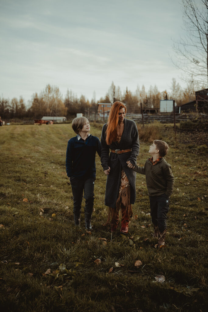 mom and her children laughing during their photoshoot