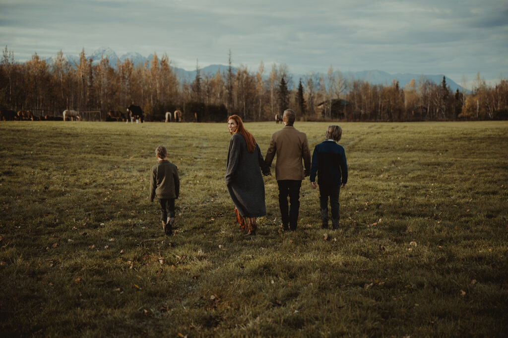 family walking around the ranch during their photoshoot