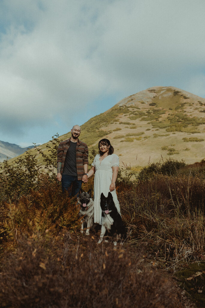 cute couple at their photoshoot with their dog 