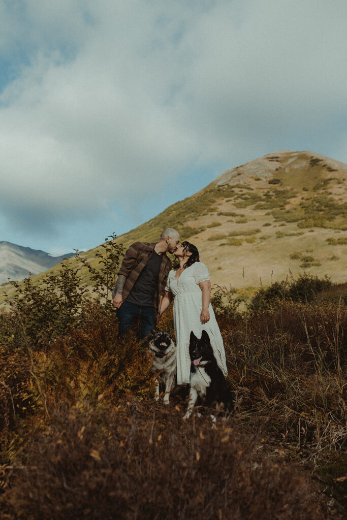 bride and groom kissing during their photoshoot