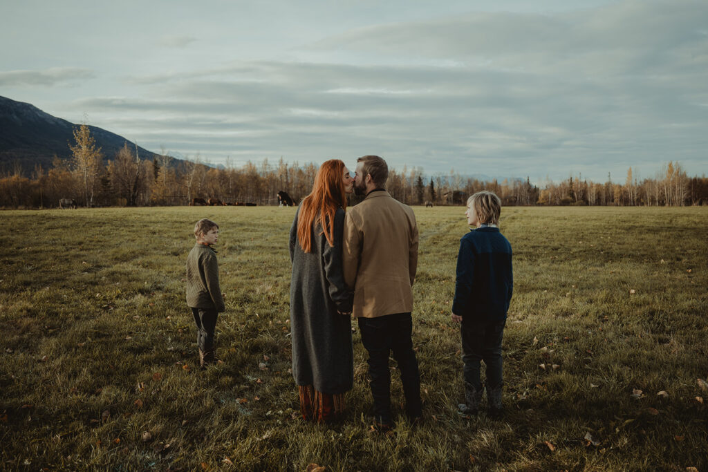 couple kissing during their family session