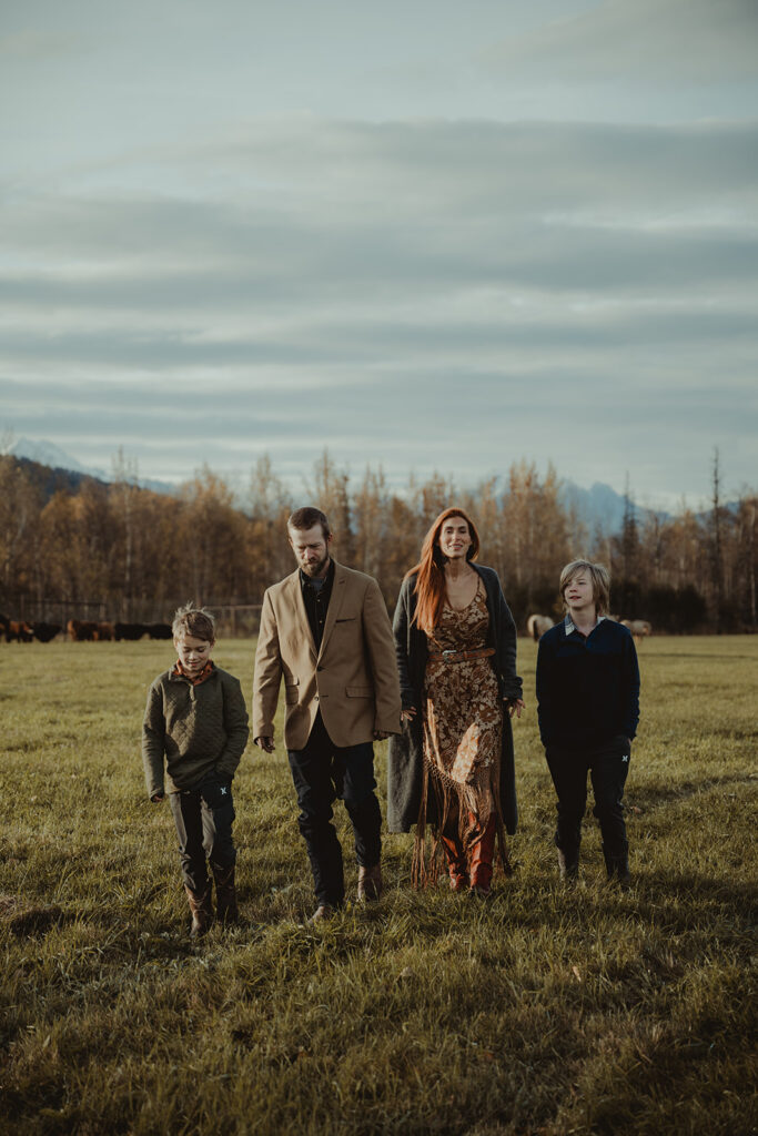 family laughing during their sunrise family photoshoot