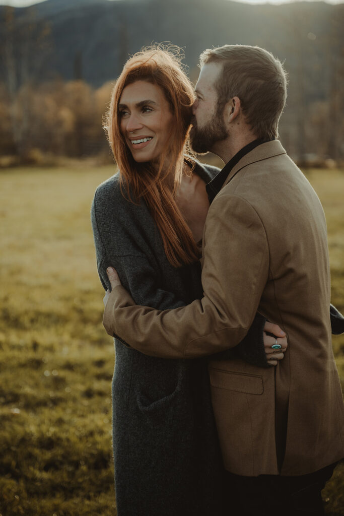 husband kissing his wife on the cheek