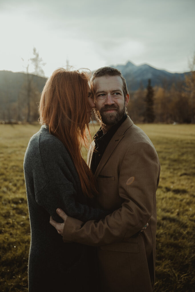 wife kissing her husband on the cheek