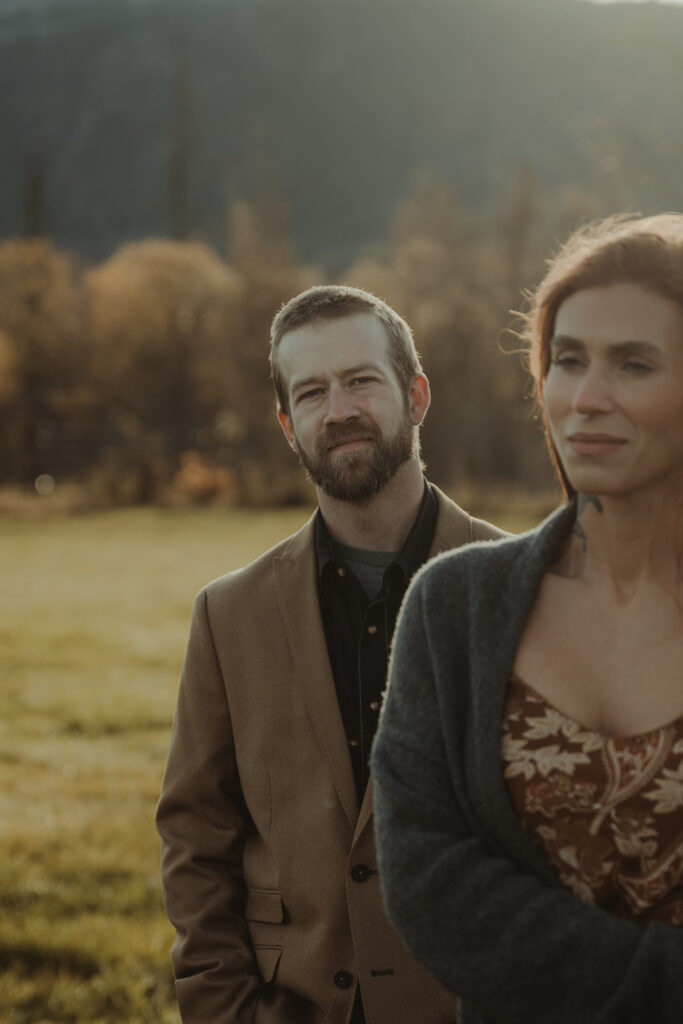 couple looking at the camera during their sunrise family photoshoot