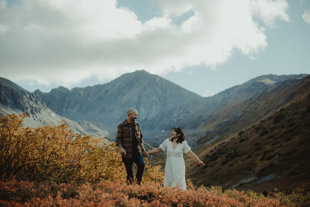 cute couple smiling during their engagement photoshoot