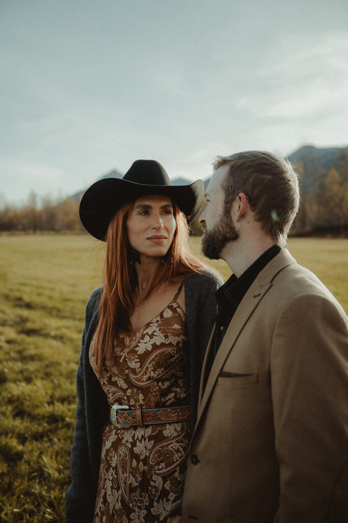 couple looking at each other during their sunrise family session