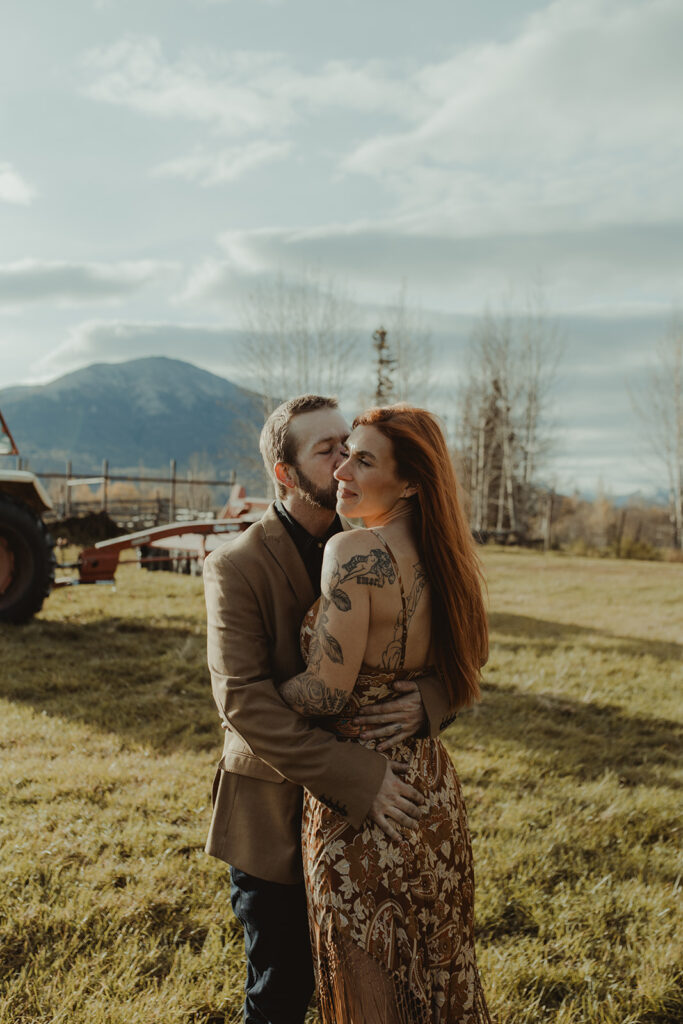 husband kissing his wife on the cheek